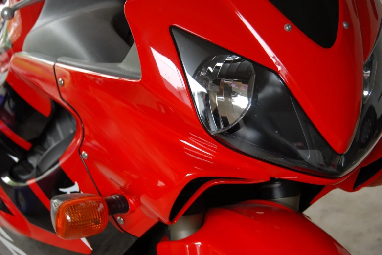a closeup view of a motorcycle front headlight