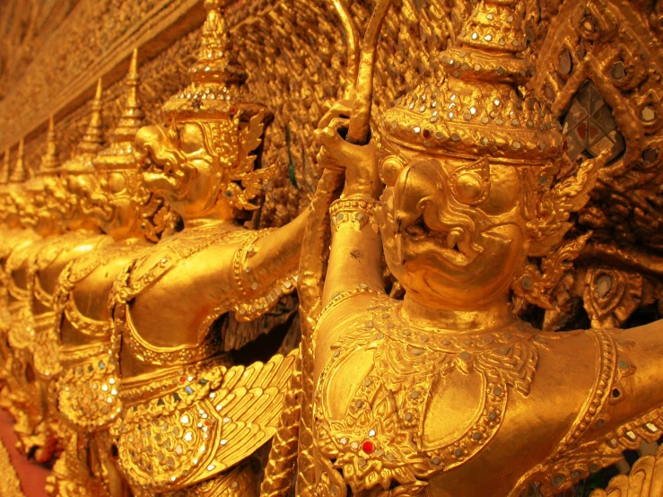 statues with a golden body in a building