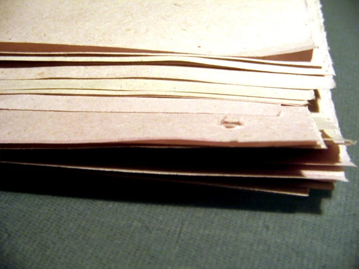 a stack of brown paper laid out on the table