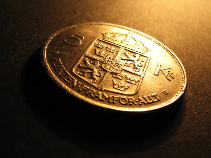 a small, round coin sits on a table