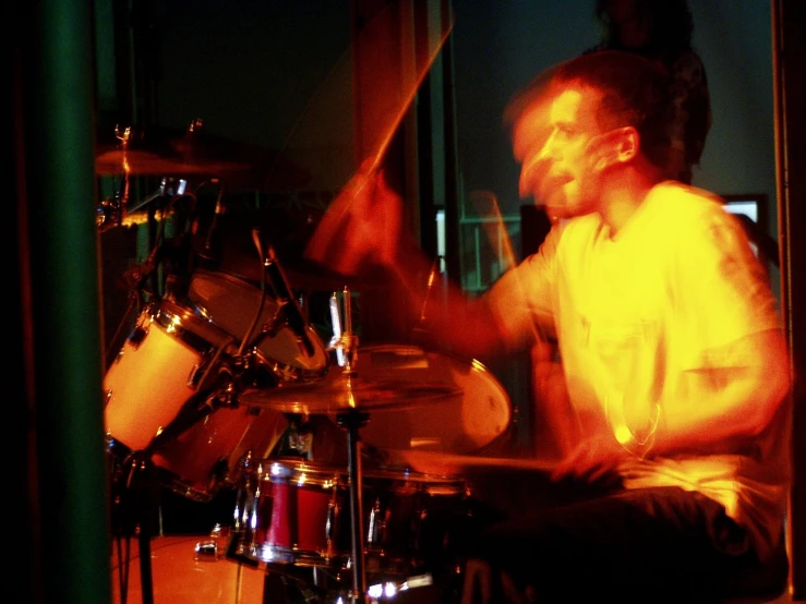 a man that is playing drums on stage