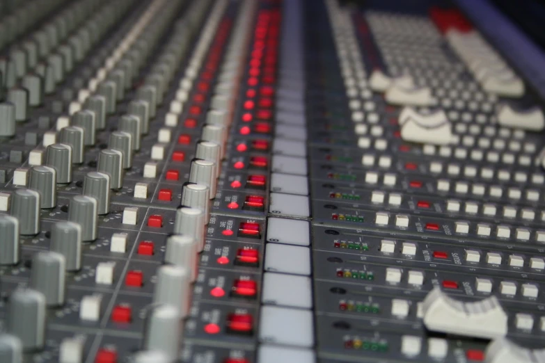 close up of an analog mixing desk in a recording studio