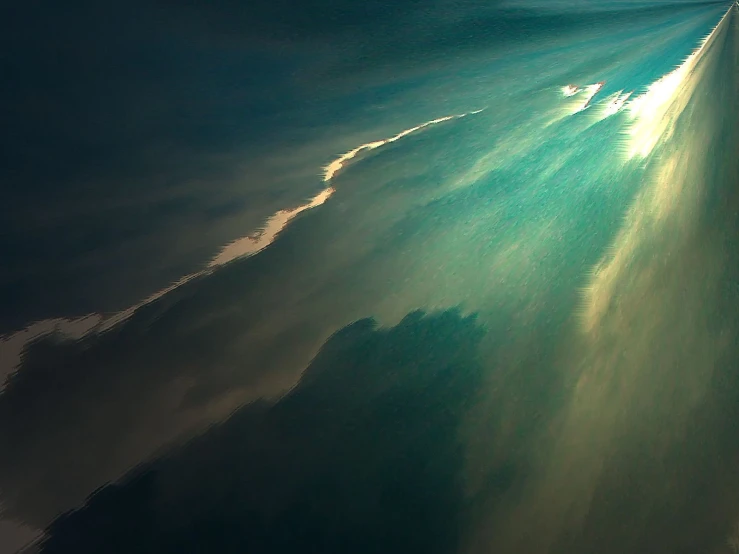 a view from the airplane shows the ocean water and clouds