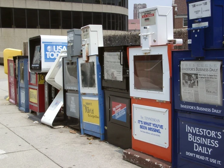 some boxes and billboards lined up next to a building