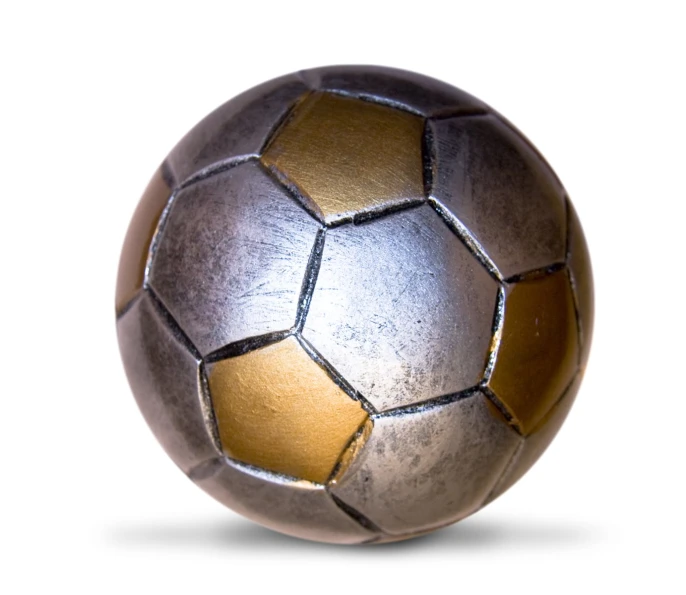 an old worn out soccer ball sits on a white surface