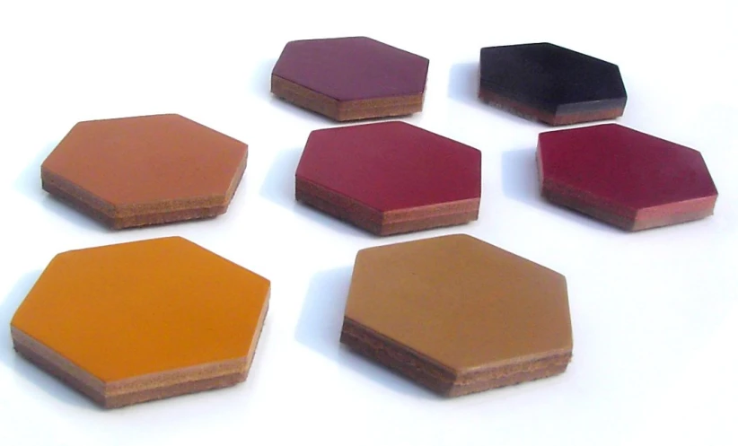 five slices of artisan chocolate arranged on white background