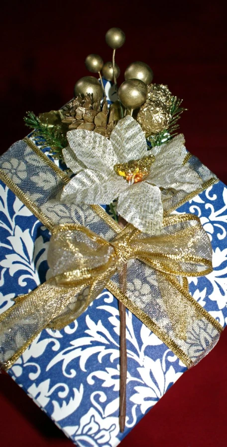 a close up of a wrapped present on a table