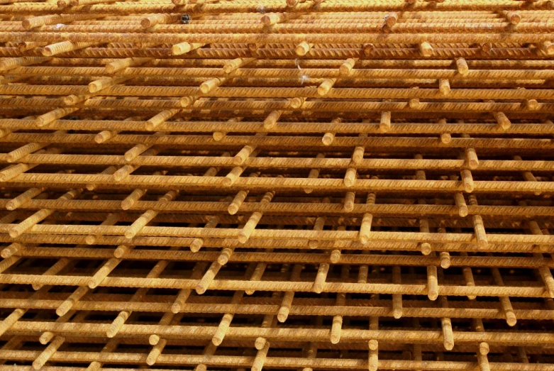 a large bunch of wooden planks in the sand