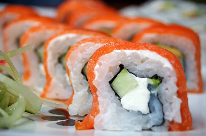 some sushi with cucumber and cream cheese