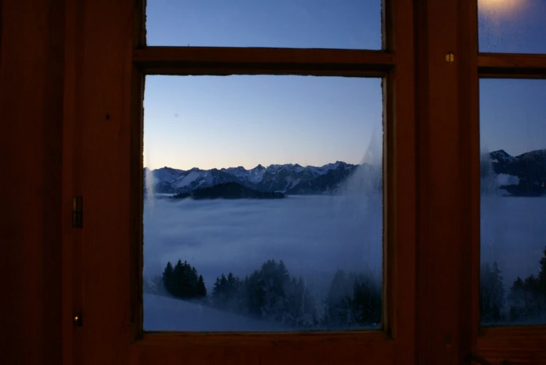 window view over fog in the mountains on a cold day