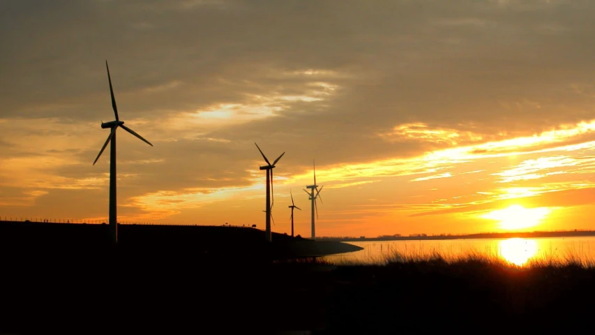 a group of wind mills sitting next to each other