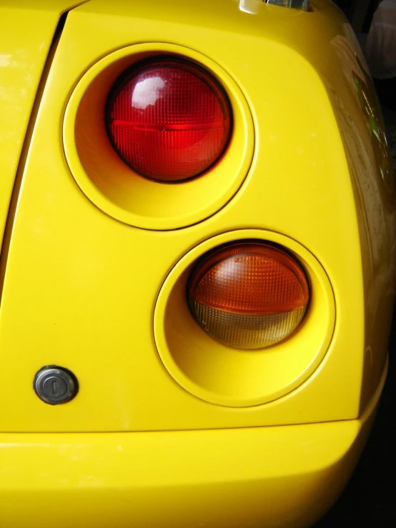 yellow car light showing and the tail lights