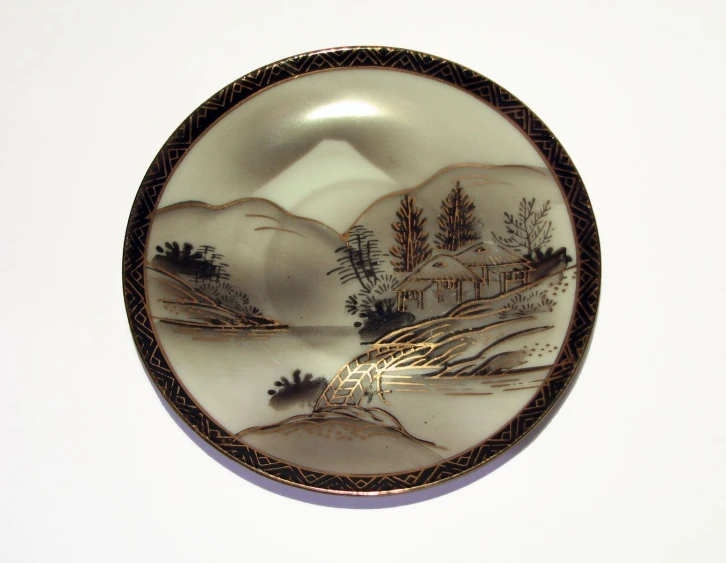 a ceramic plate on display with black trim