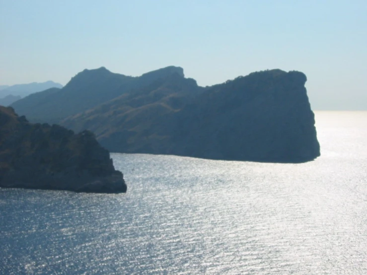 large mountains overlooking the water from an island