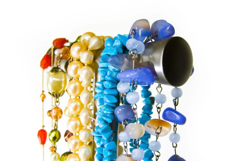 a group of multi colored beads and glass objects