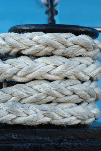 a white rope that is connected to a boat
