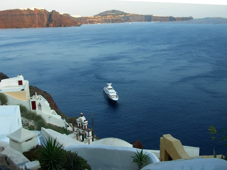 the large boat is sailing through the blue water