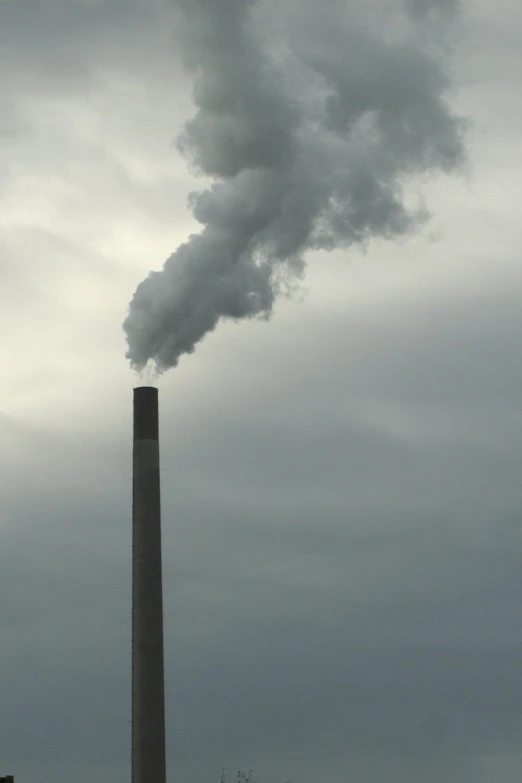 smoke coming from a chimney coming out of the sky