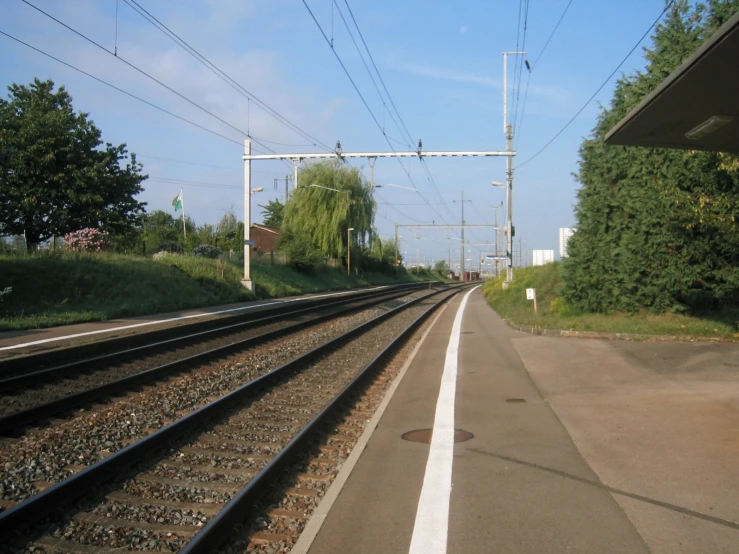 train tracks on a city track next to a platform