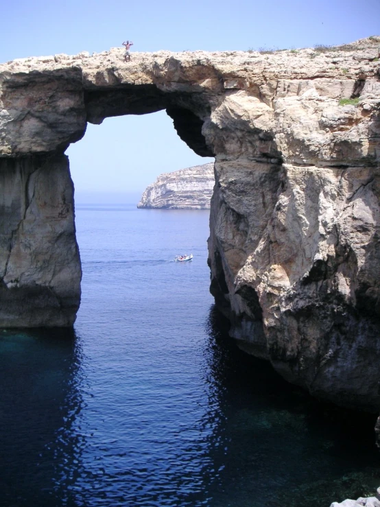 two rocky formations are built above the water