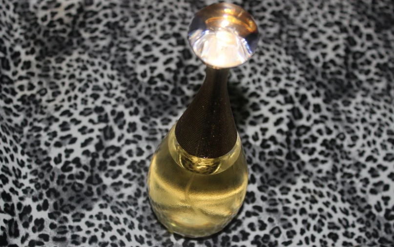 a wine glass on top of a leopard print table cloth