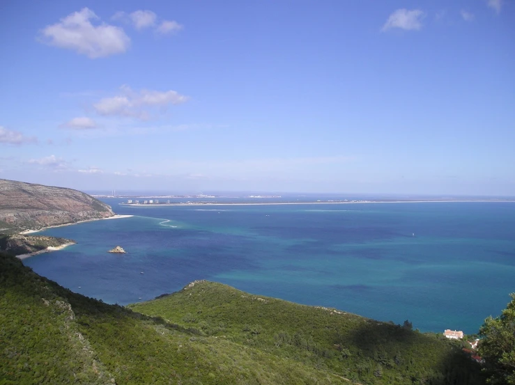 the water is deep and blue, revealing the clear green waters