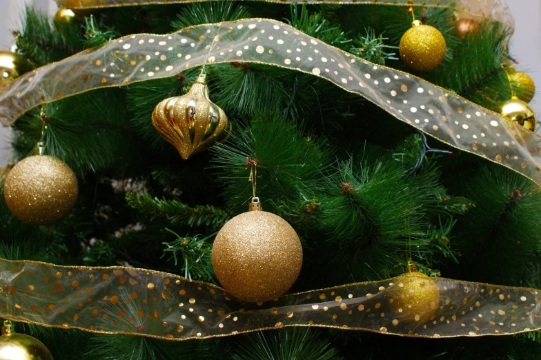 a christmas tree with many ornaments hanging on it