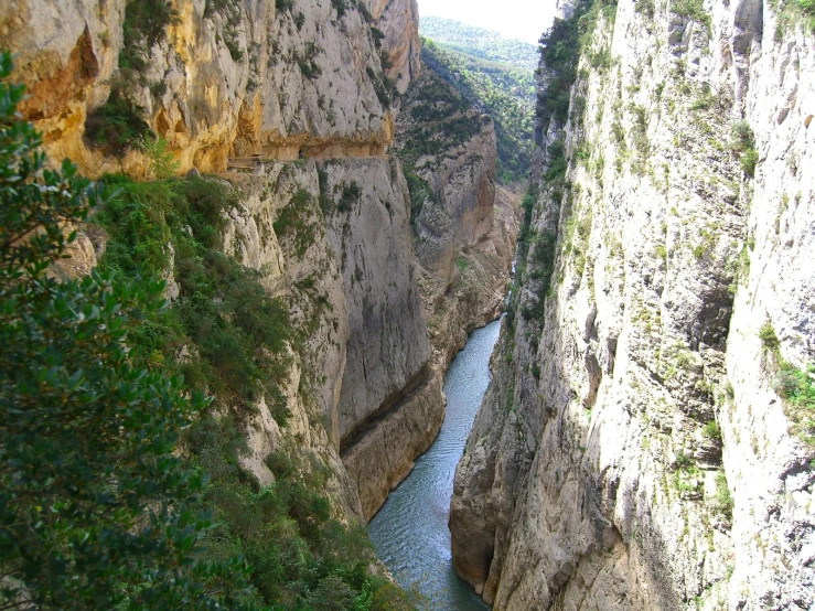 a river in the middle of some cliffs