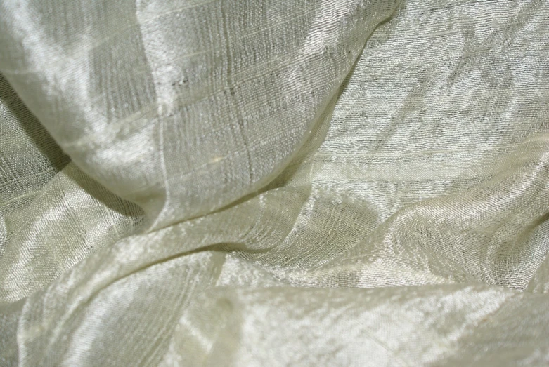 close up of white fabric background with a slight pattern