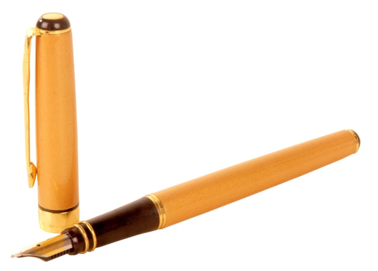 an opened pen laying next to a golden colored pen