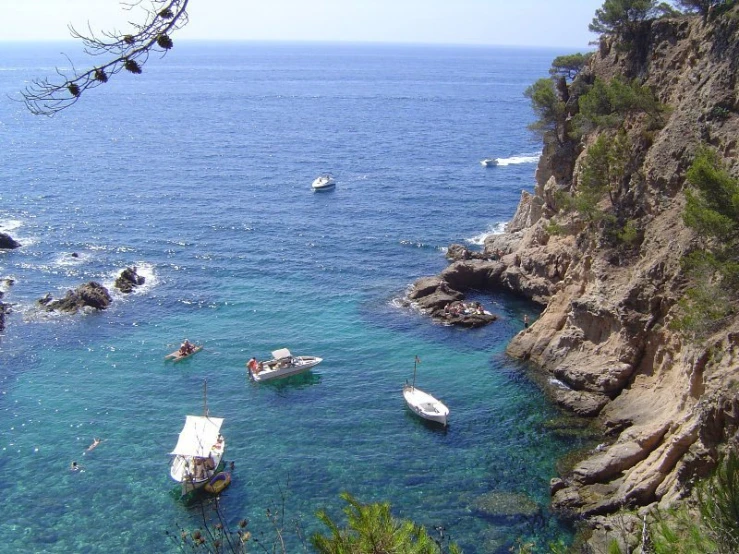 a harbor filled with small boats floating on top of it