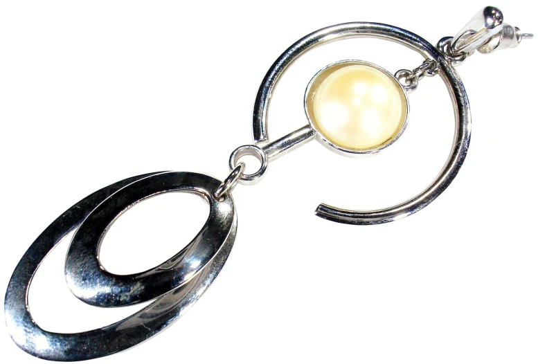 a po of a silver - plated pendant with an inner bea