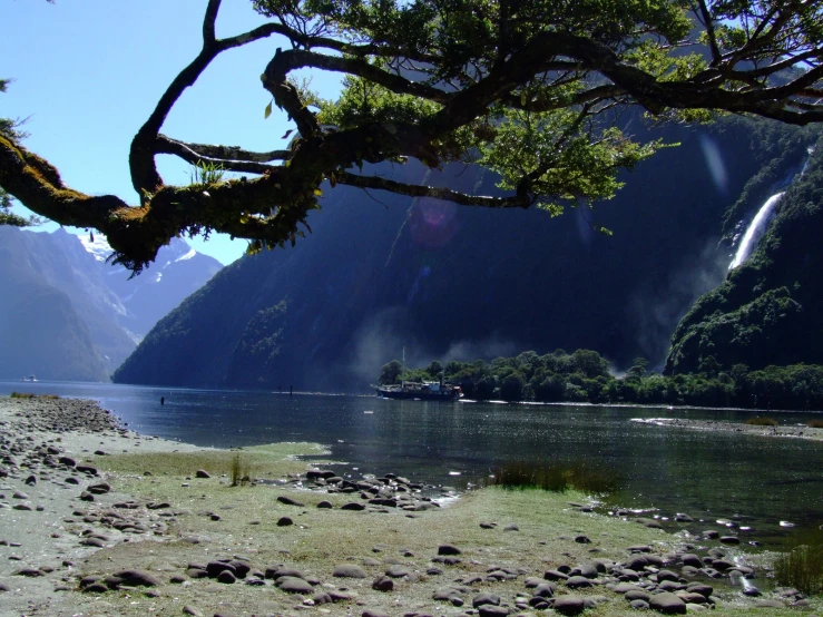 an image of a view of a lake surrounded by mountains