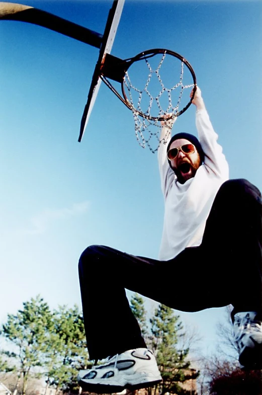 an image of a man trying to jump for the basketball