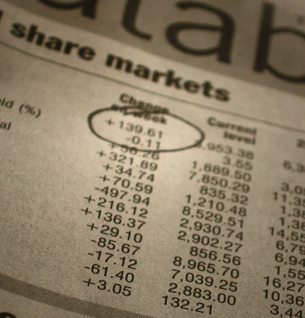 a newspaper showing different market numbers from the 1950 - 70's