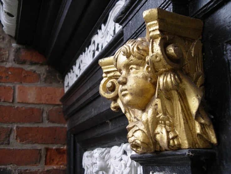 an elaborate head on the side of a building