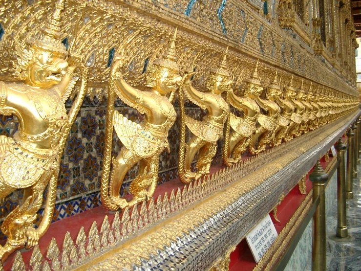 rows of shiny gold, ornate gold carvings