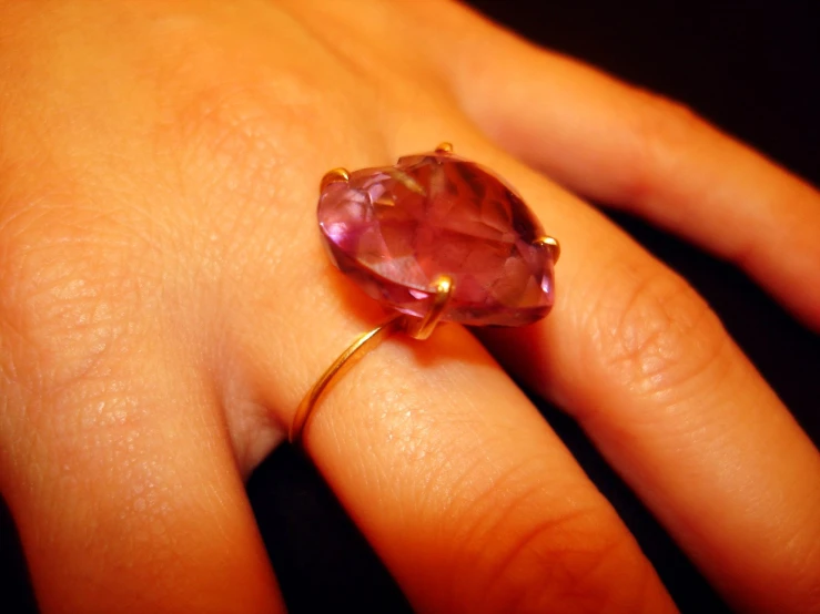 closeup of an elegant ring adorned with pink stones