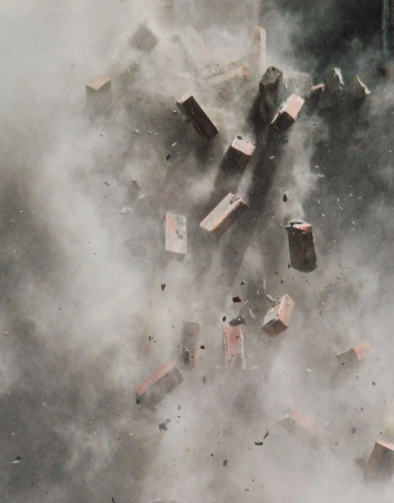 an aerial view of a group of buildings exploding