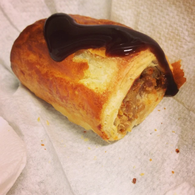 a pastry has chocolate sauce in it