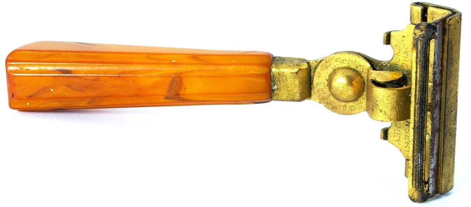 an orange colored handle on a wooden door
