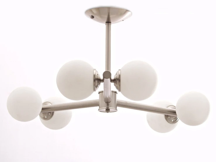 a ceiling mounted light with five white spheres