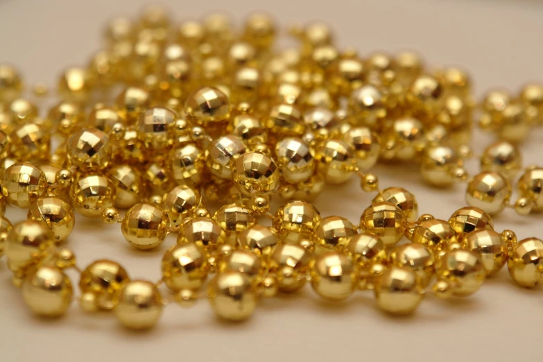 large gold beads in the shape of spheres