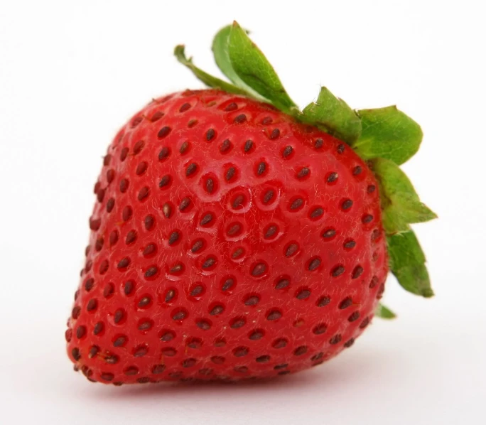 a close up of the front of a strawberry