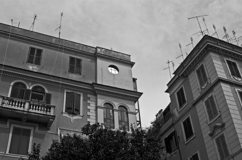 black and white po of two buildings with clock