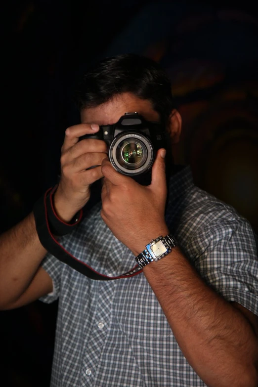 a man is taking a po in a mirror with a camera