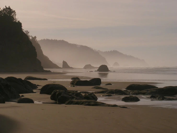 a beach with lots of rocks and water