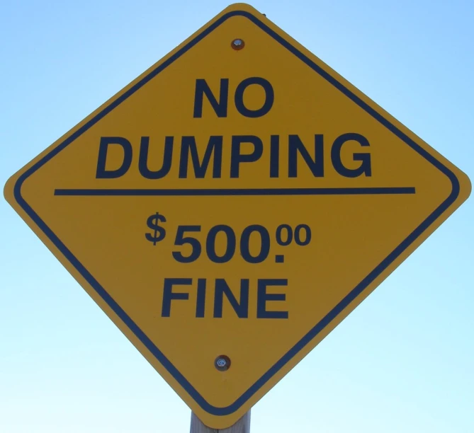 a yellow street sign with black writing says no dumping $ 500 00 fine