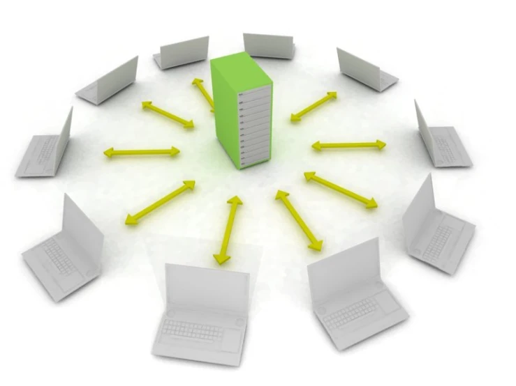 a green box surrounded by yellow laptops on a white surface