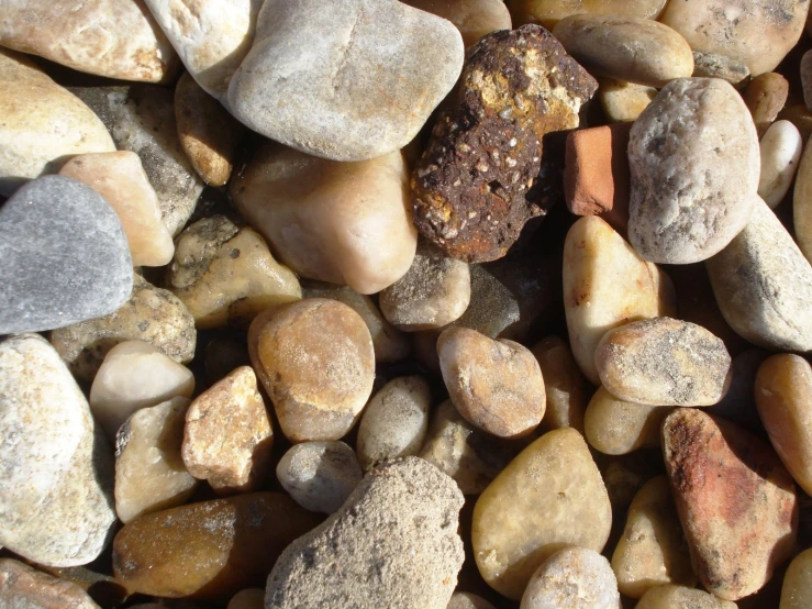 some rocks and pebbles together with small pieces